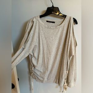 Cream light weight sweatshirt cut out shoulders